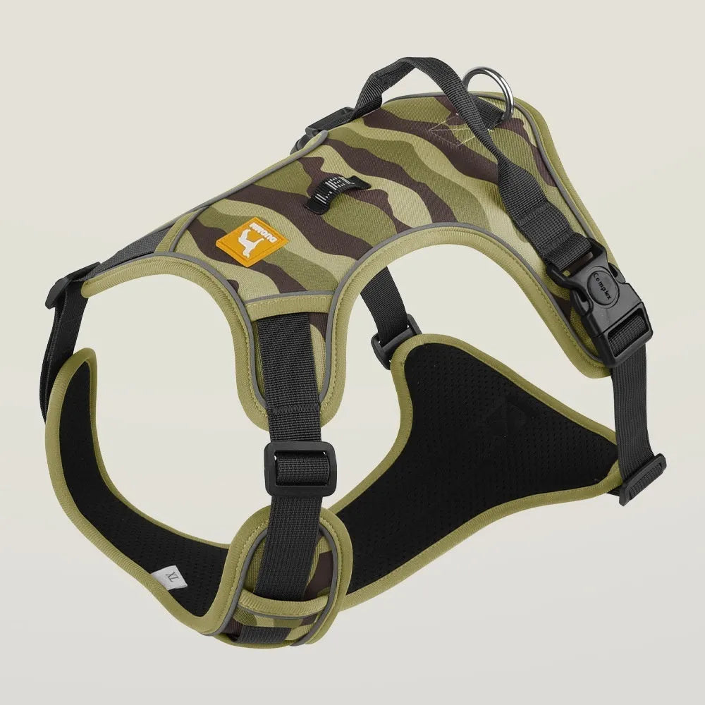 Orange reflective dog chest and back harness with an attached hand-holding rope on a grey background.
