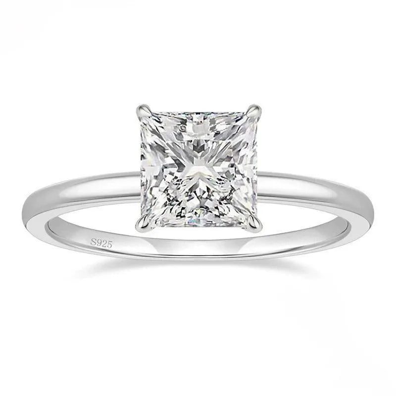 Simple geometric 925 silver ring in silver, gold, and rose gold colours on a plain background.