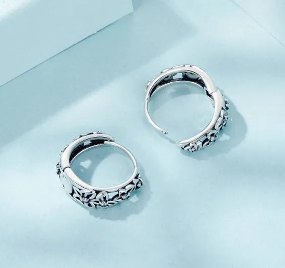 Hollow butterfly earrings in sterling silver with zircon detailing, 14mm height