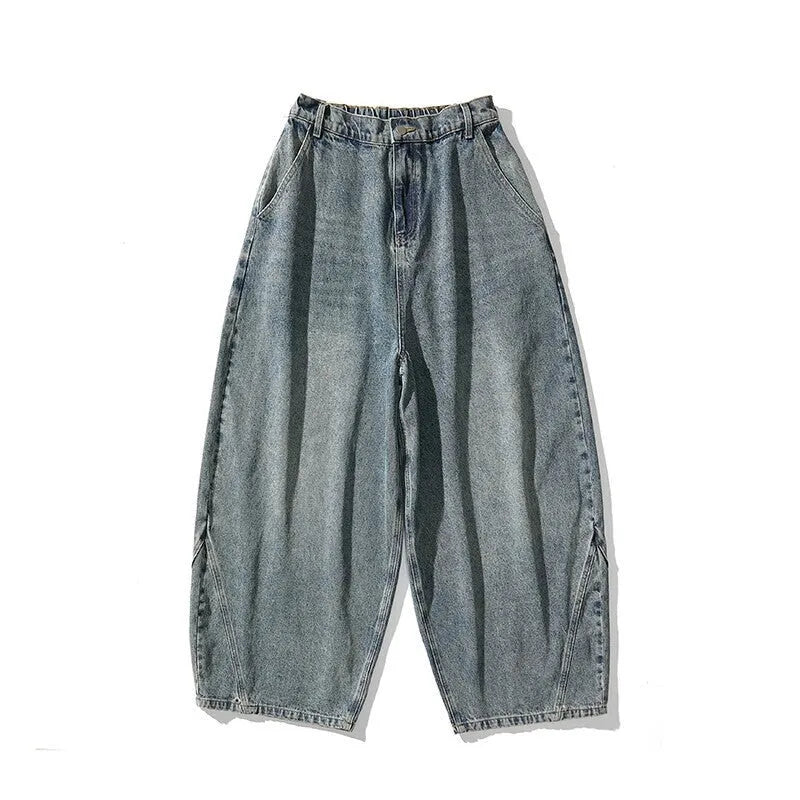Men's plus size light blue wide leg baggy jeans on a neutral background