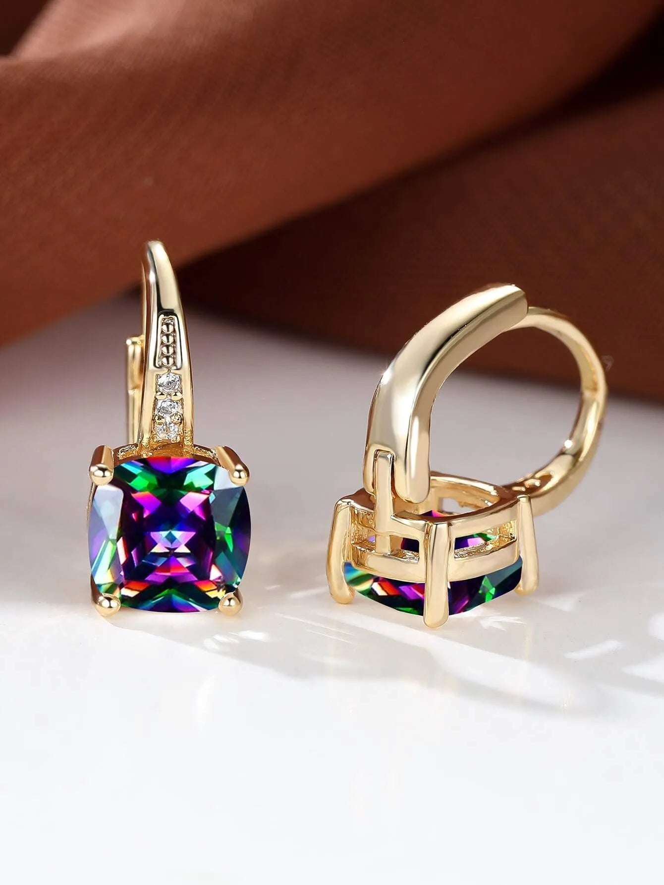 Geometric square copper ear clip earrings with moissanite inlays in a gold electroplated finish.