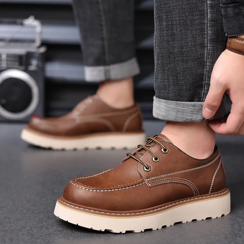 Men's black retro low-top Martin boots with a round toe and rubber sole.