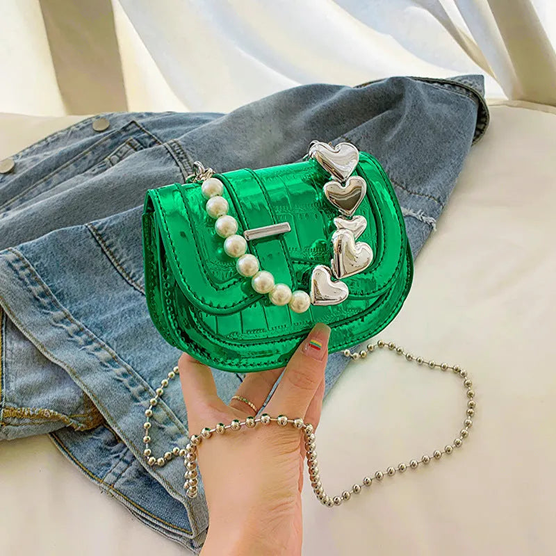 Laser pearl effect mini saddle tote handbag in horizontal square shape with crossbody strap