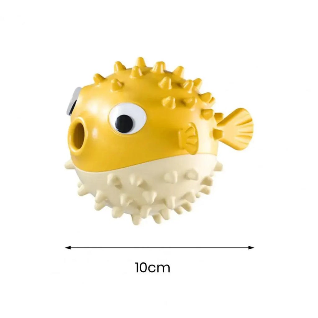 Yellow vinyl fish-shaped dog chew toy with textured surface and squeaker.