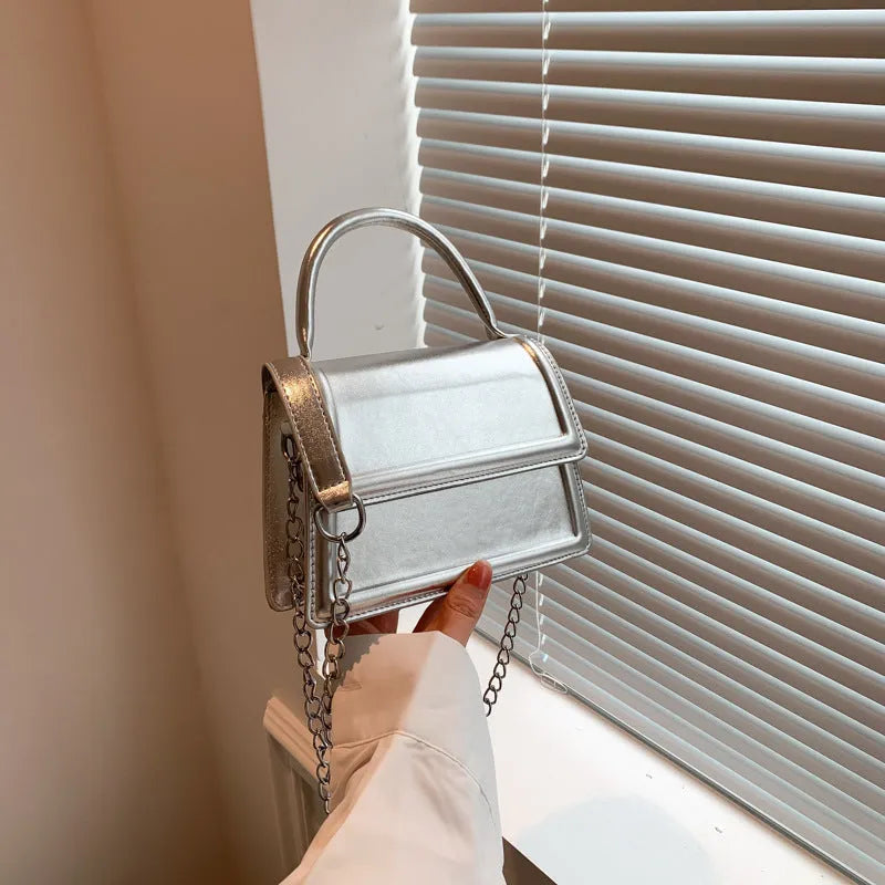 Silver PU leather crossbody shoulder bag with square shape and sewing line detail