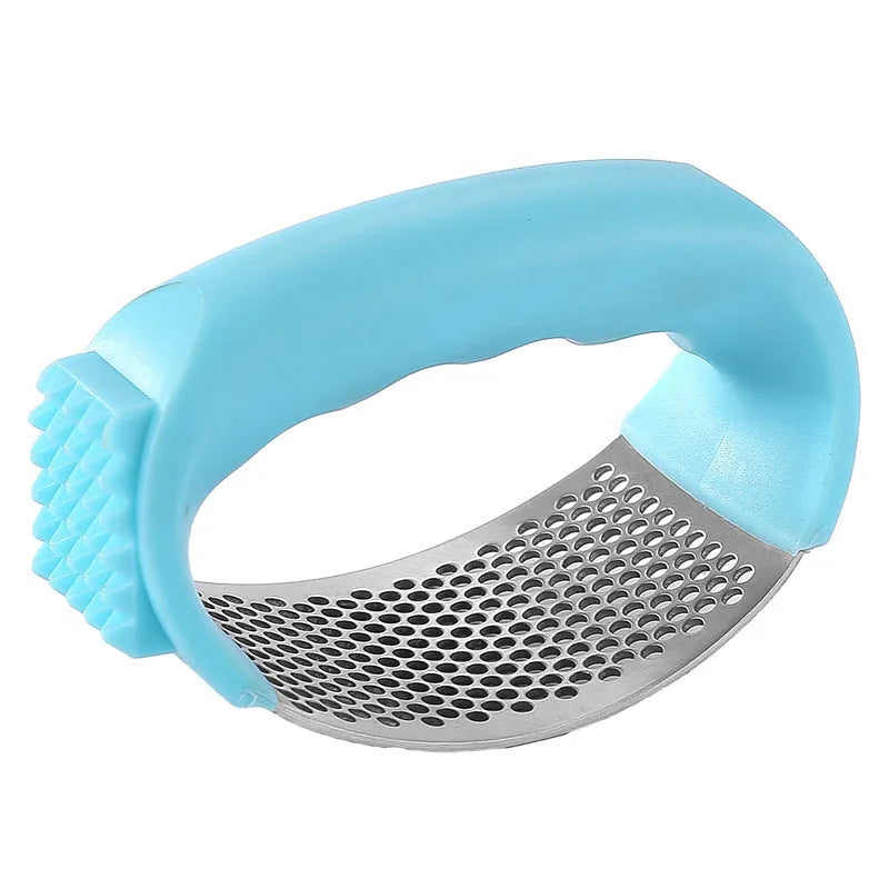 304 stainless steel garlic press in black, blue, green, and pink colour options on a kitchen counter