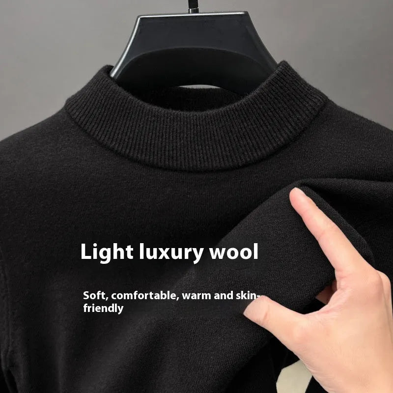 Men's solid colour fine yarn half-turtleneck long sleeve pullover on a hanger.