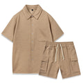 Plain grey polyester two-piece set with short sleeve top and elastic waist shorts laid flat.