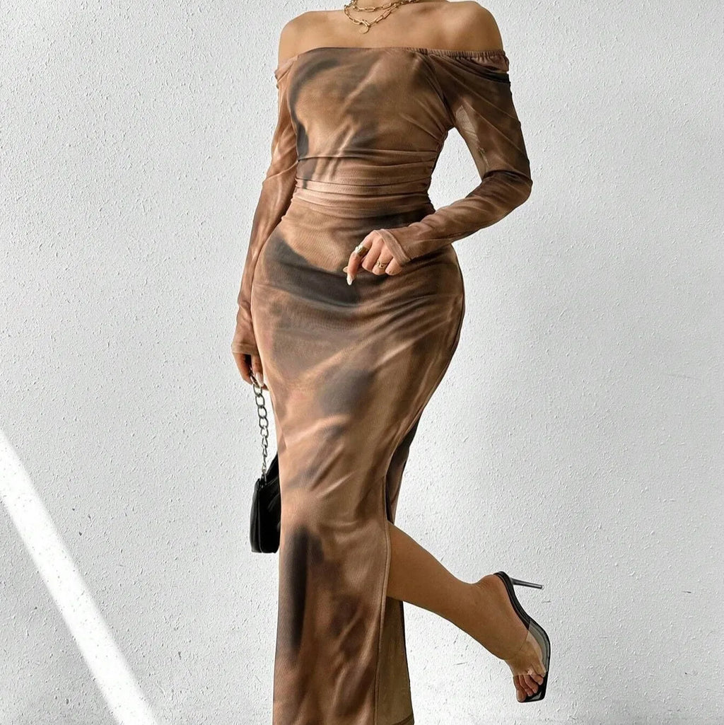 Long green mesh fishtail evening dress with a square collar, pleats, and a side split.