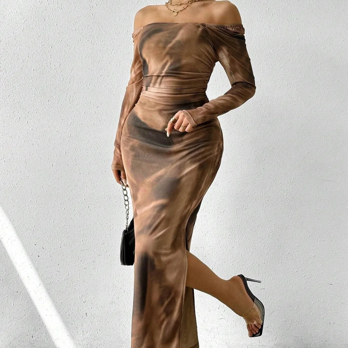 Long green mesh fishtail evening dress with a square collar, pleats, and a side split.