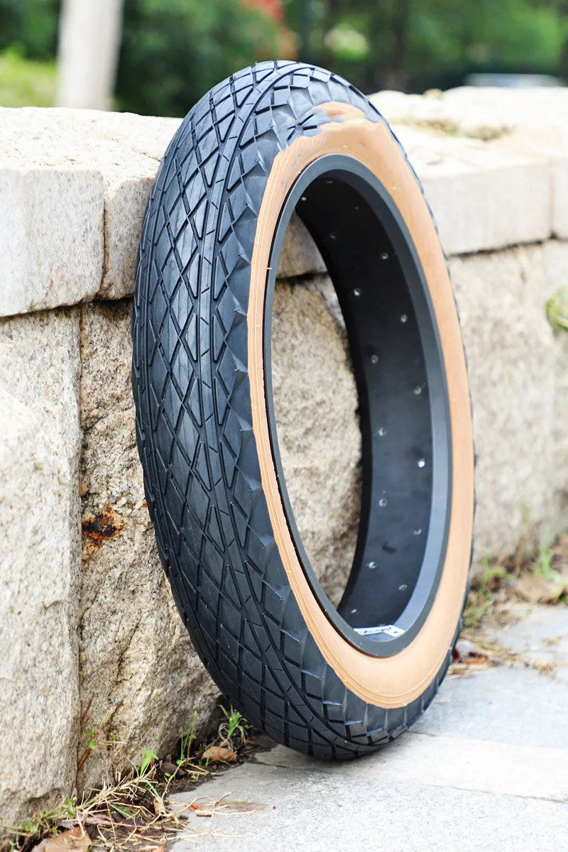 Brown rubber tyre with skin edge pattern for snowmobiles and electric beach carts, 20x4.0 inch dimensions