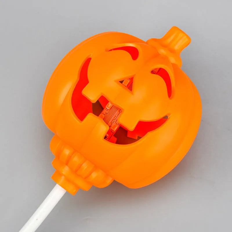 Plastic pumpkin-shaped lamp with USB charging cable, showing purple light option.