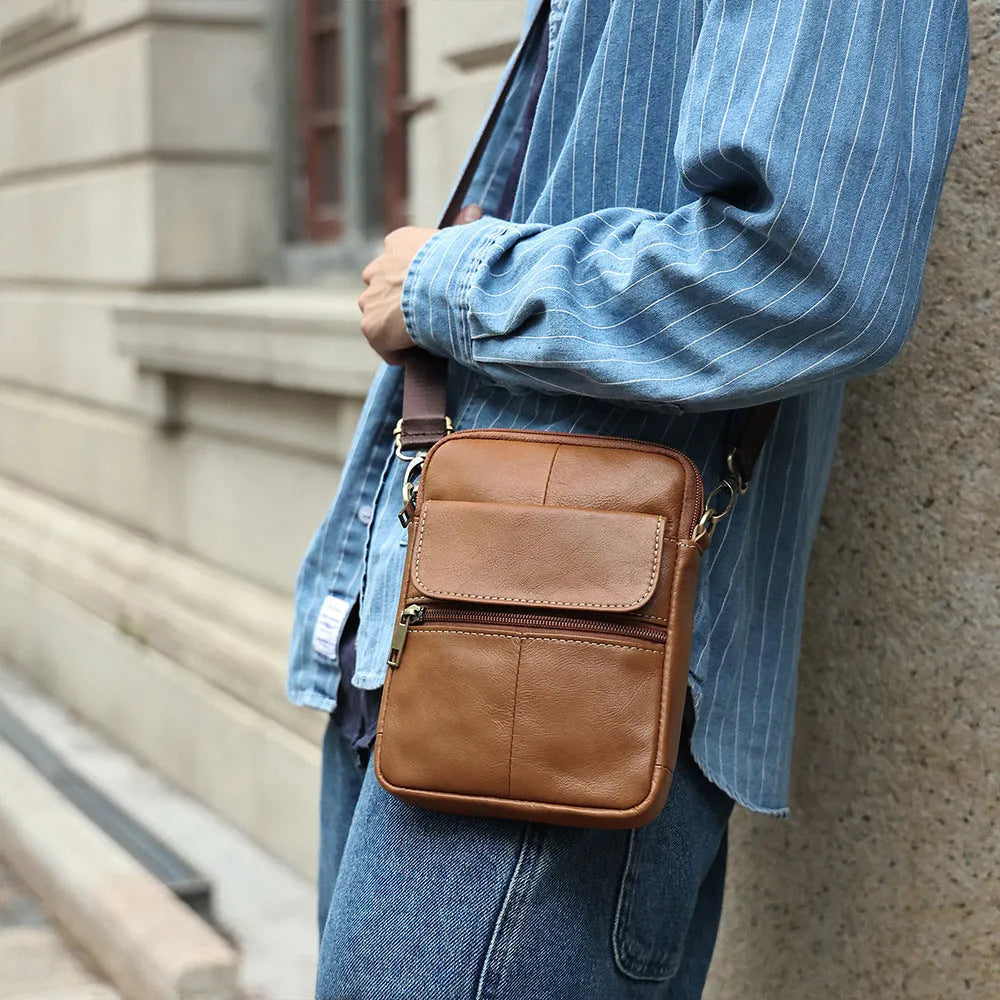 Men's brown genuine leather crossbody shoulder bag showing sewing line detailing