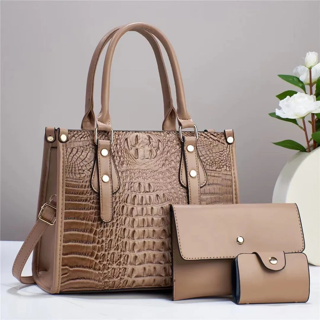 Women's burgundy PU leather bucket crossbody bag set with matching wallet and card holder.
