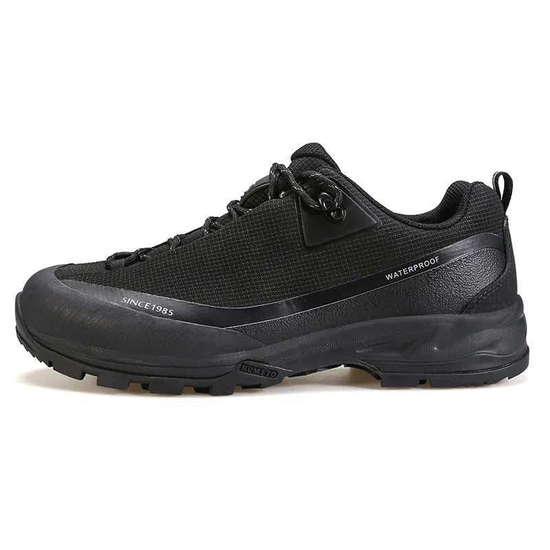 Men's low-top mountain climbing shoes in black with non-slip rubber outsole and lace-up design