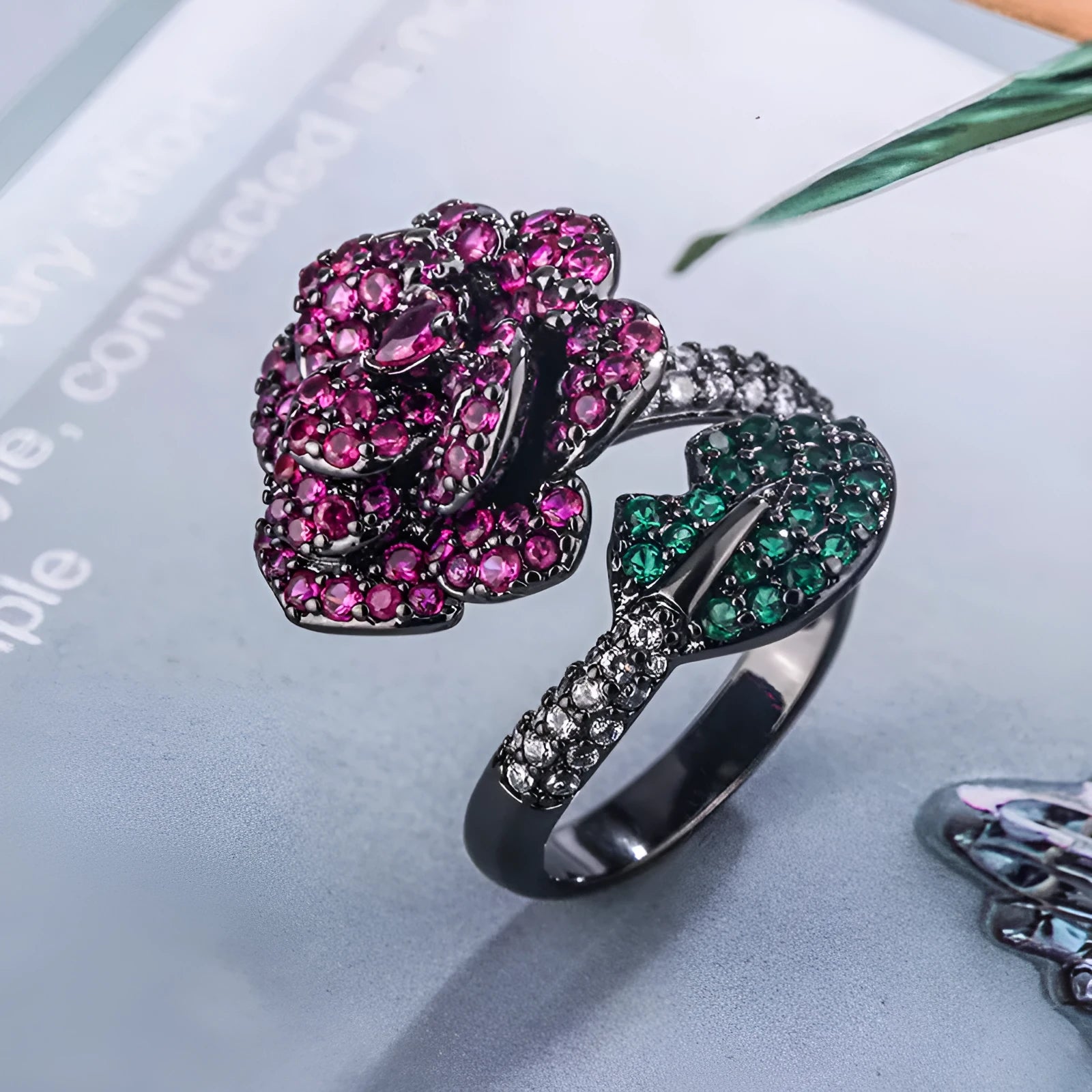 Gold-plated black gold ring with simulation red corundum stone and geometric flower design