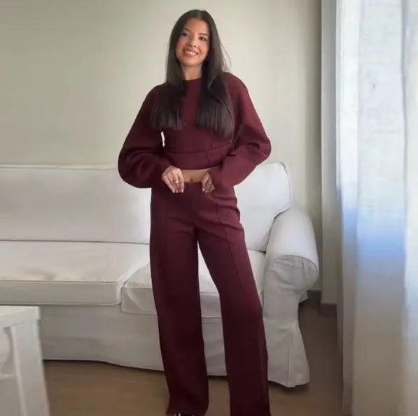Women's apricot colour polar fleece lounge suit featuring a long sleeve pleated top and wide-leg trousers.