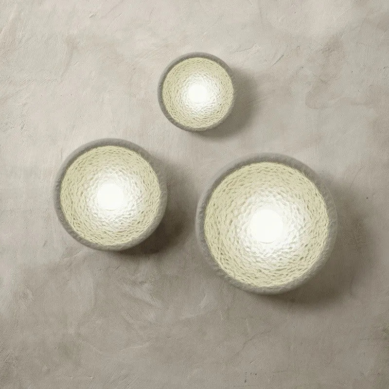Japanese-style simple silent wall lamp with resin shade in warm white light.