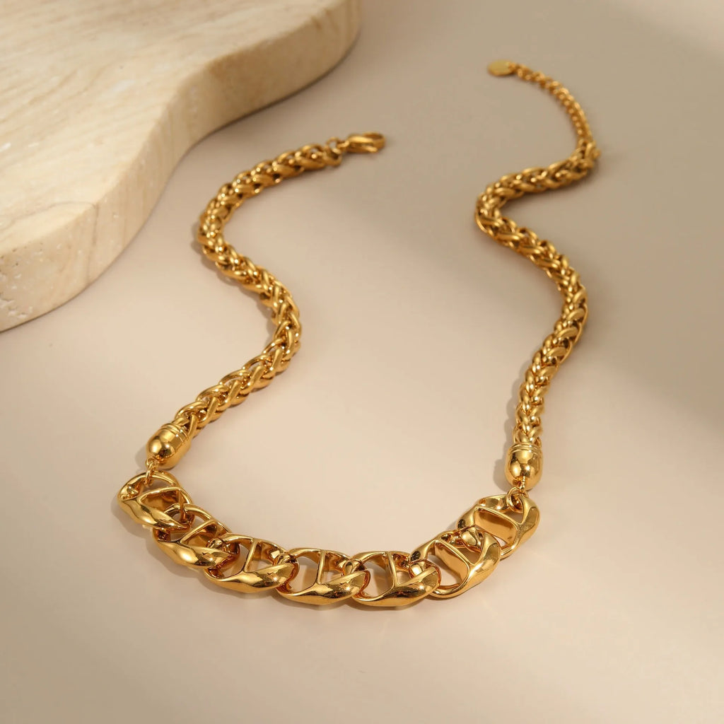 Stainless steel necklace with geometric pendant and electroplated 18K gold finish