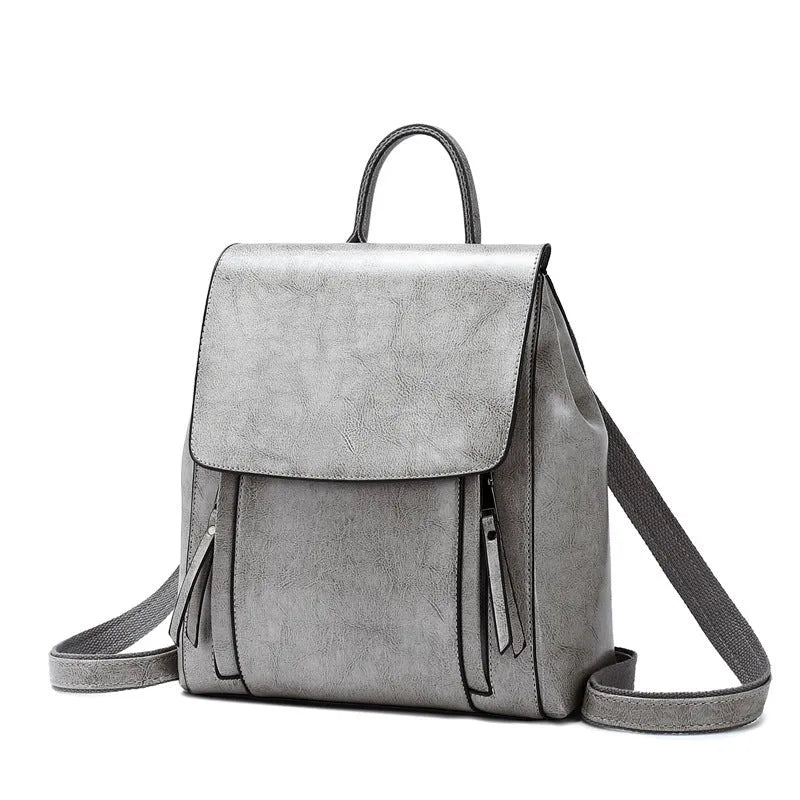 Genuine leather women's backpack in black with multiple compartments and dual shoulder straps