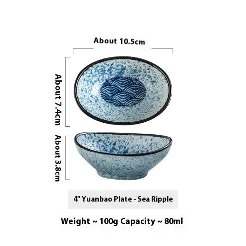 Oval Japanese ceramic sauce dipping bowl on a table, showing its 5cm height and decorative underglaze pattern.