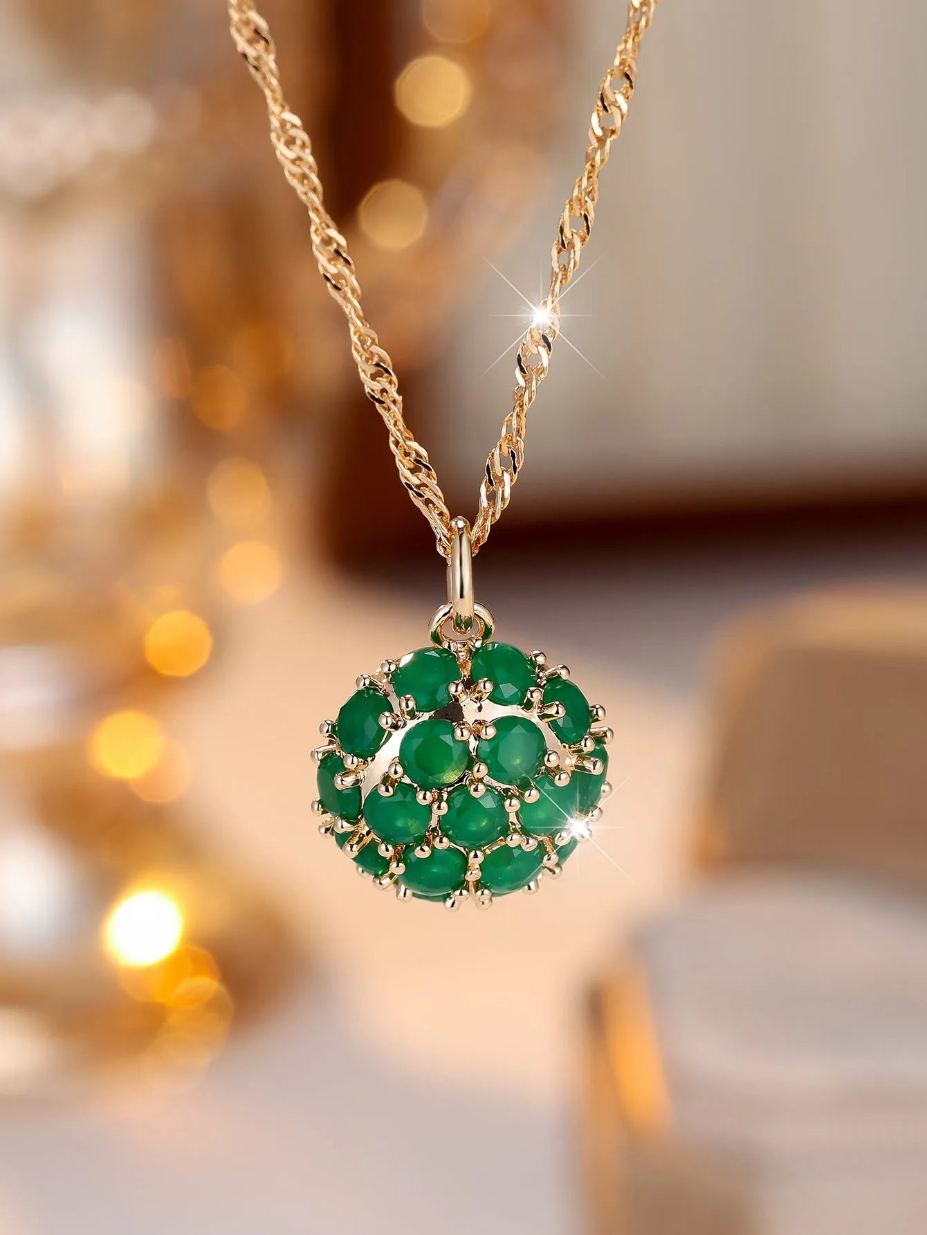 Round emerald and diamond pendant necklace in champagne gold colour on copper chain