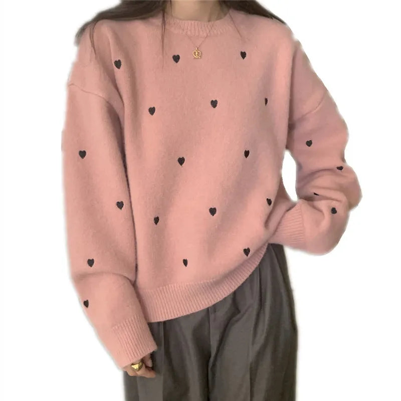 Women's loose fit cream pullover sweater with love heart embroidery detail on the front