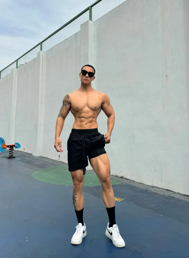 Men's quick-drying double-layer nylon shorts shown in multiple colours.
