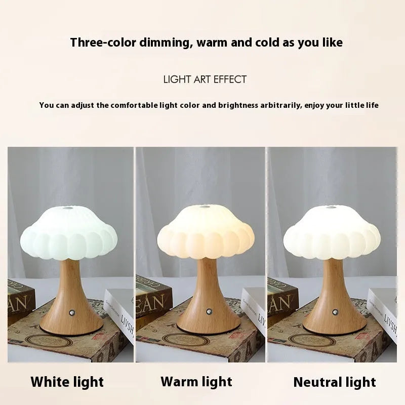 Small touch control rechargeable mushroom night light in wood grain colour on a table.