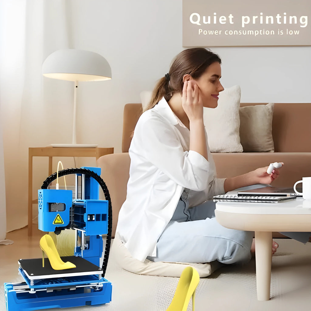 K9 New Mini desktop 3D printer in black or blue colour on a workspace.