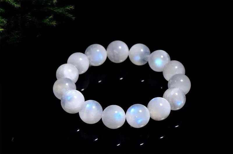 Natural blue moonlight round bead moonstone bracelet showing polished stone beads on wrist