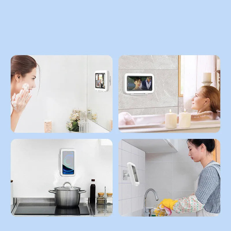 White plastic waterproof phone holder mounted on tile with phone inside, showing touch screen and anti-fog window.