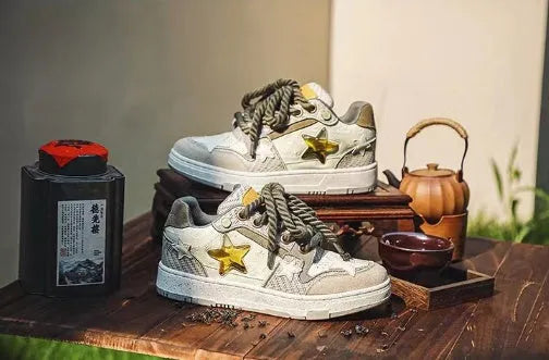 Green casual shoes with star pattern stitching, mesh lining, and thick rubber soles