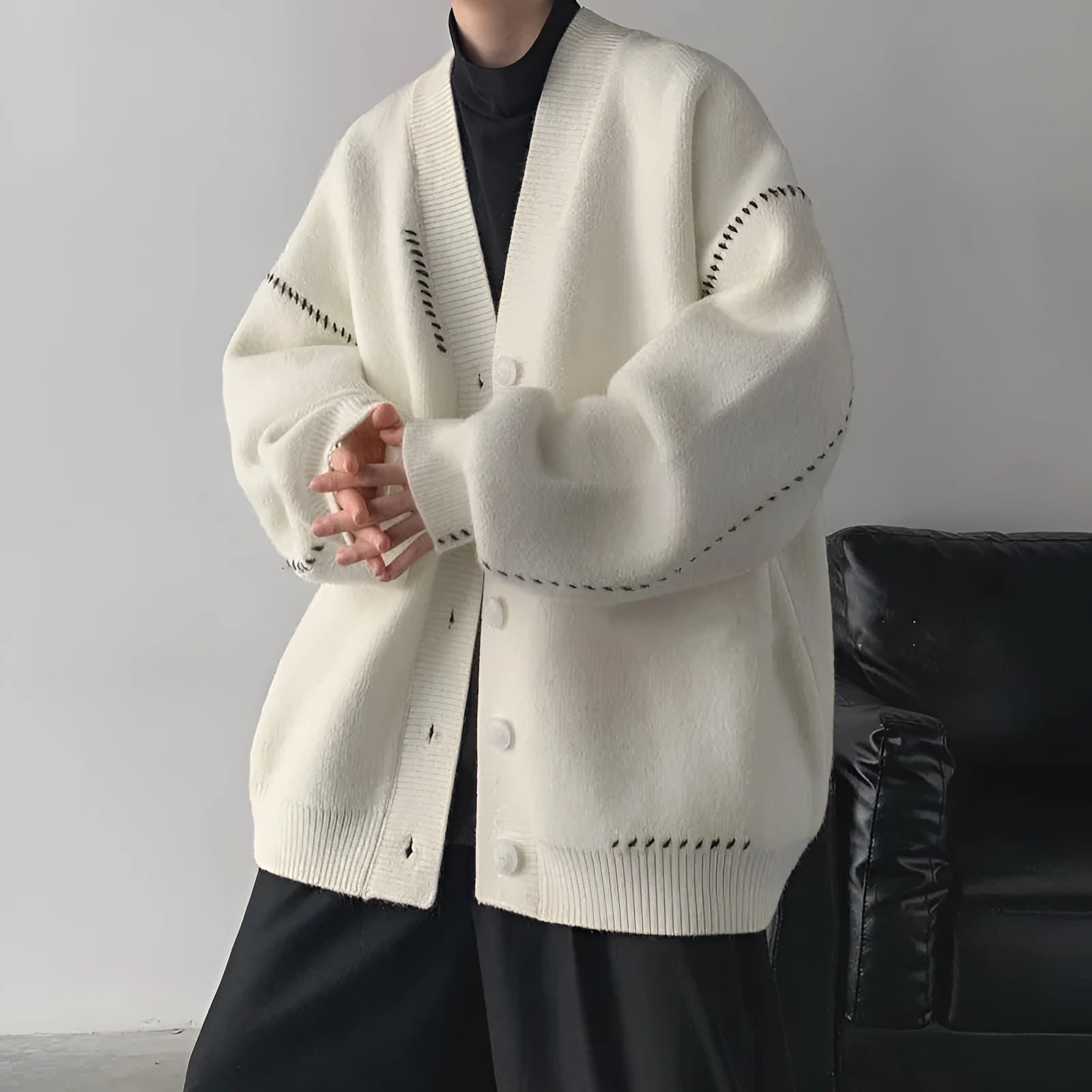 Women's knitted cardigan top coat in black solid colour with long sleeves and loose fit