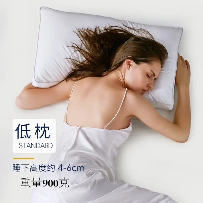 White hotel cotton satin stripe feather and cotton blend pillow showing satin stripe detail.