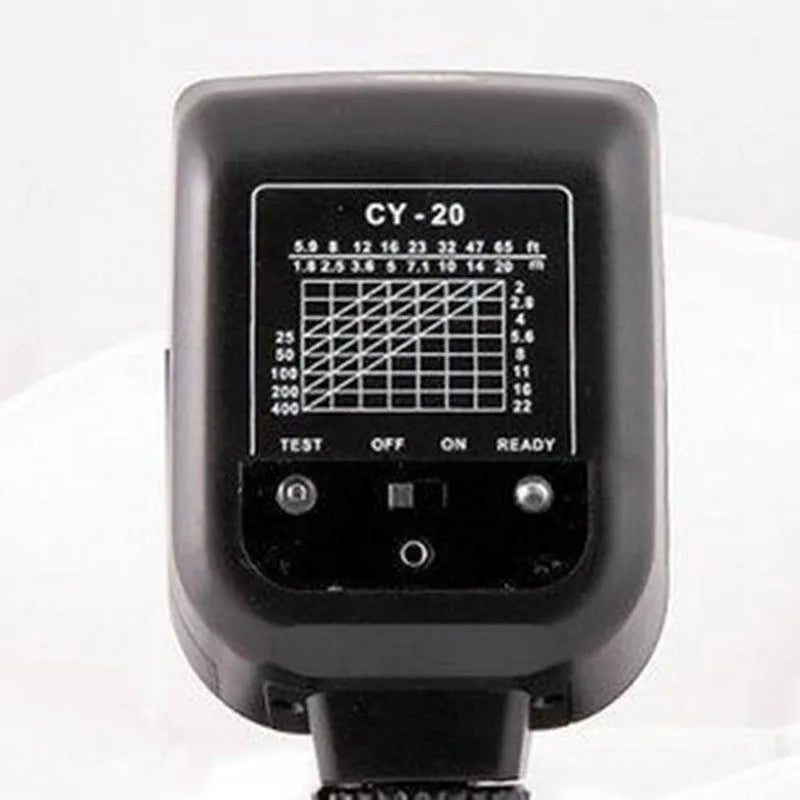 Compact black SLR camera flash unit shown tilted upwards on a hotshoe, illustrating its 90-degree bounce flash capability.
