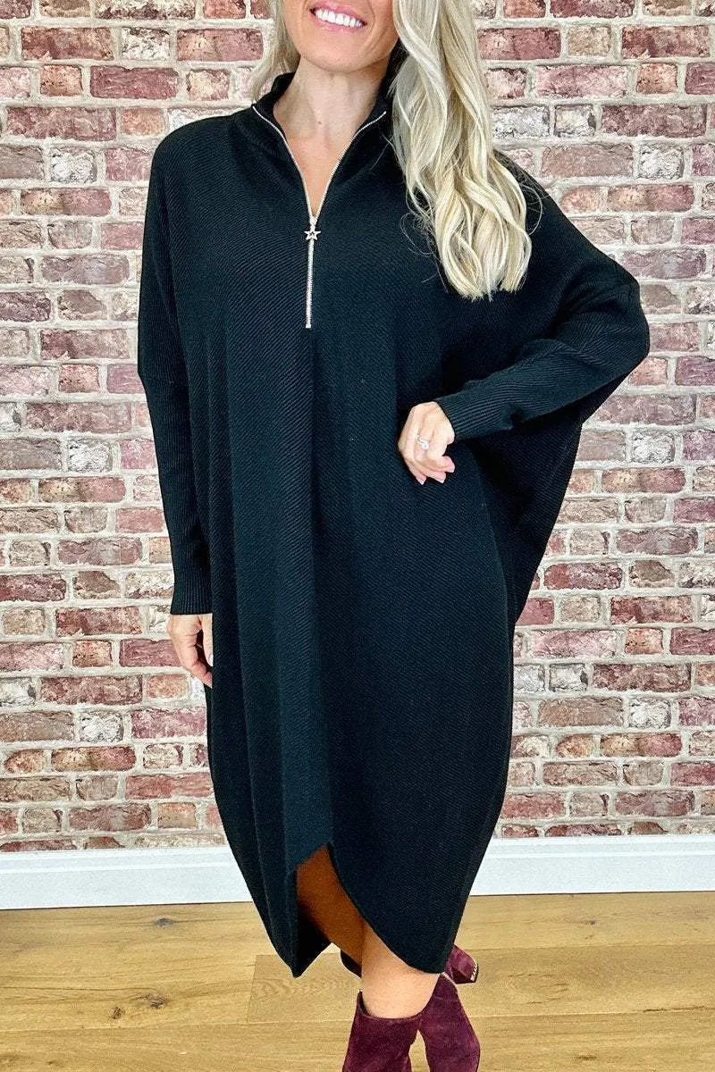 Women's solid colour loose fit knit dress with raglan sleeves on a hanger.