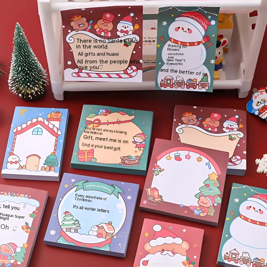 Christmas cartoon sticky notes stationery book with holiday designs including elf, gift, sled and Santa Claus