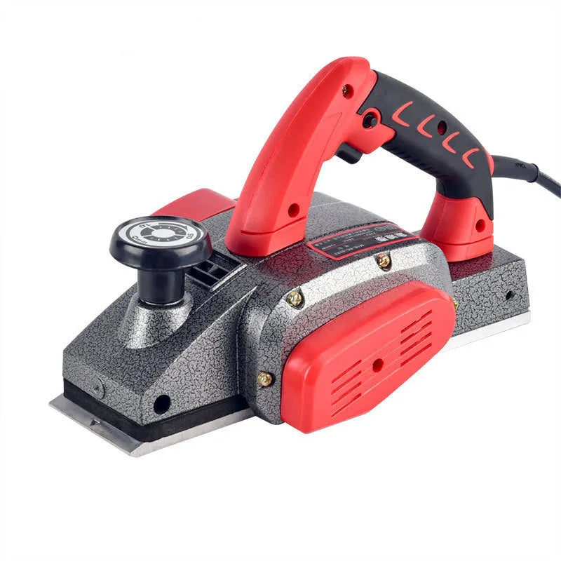 Red aluminium shell electric wood planer tool with 82mm planing width on a workbench.