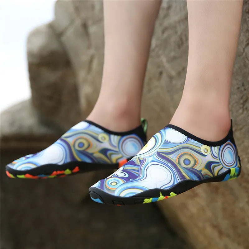 A pair of Lycra beach wading shoes with an EVA midsole, shown in camouflage colour.