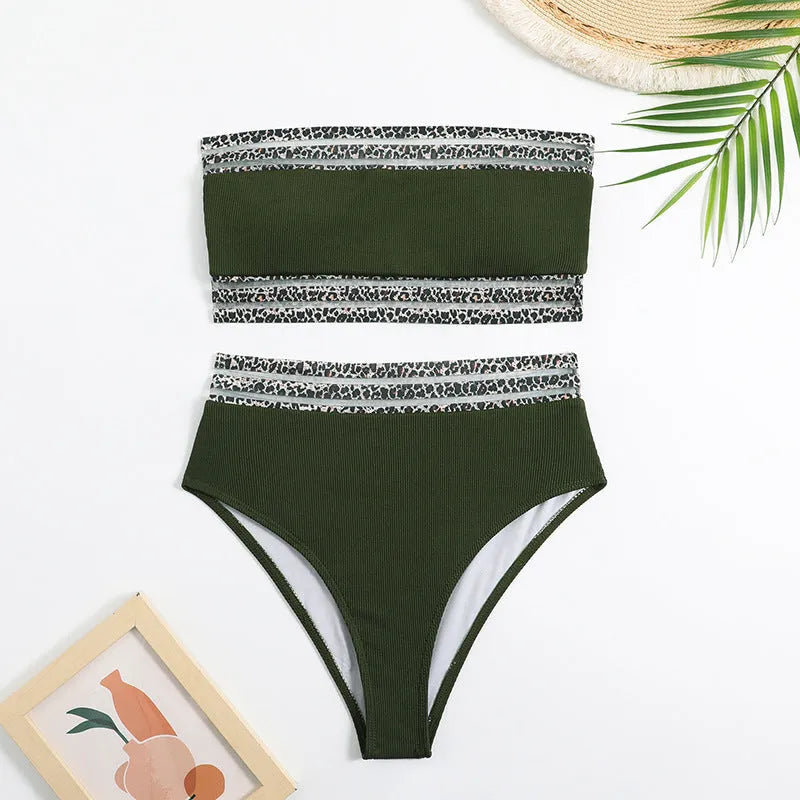 Black strapless bikini top and shorts with leopard print detail, laid flat.