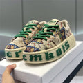 Men's low top printed board shoes in blue with cloth upper and rubber sole