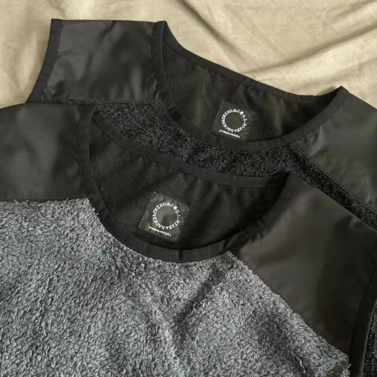 Men's lightweight fleece lined thermal vest in black solid colour with loose fit