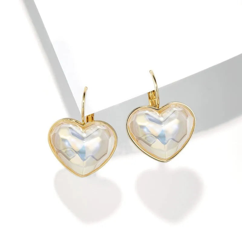 Gold tone alloy ear clips for women with clip-on design and natural styling