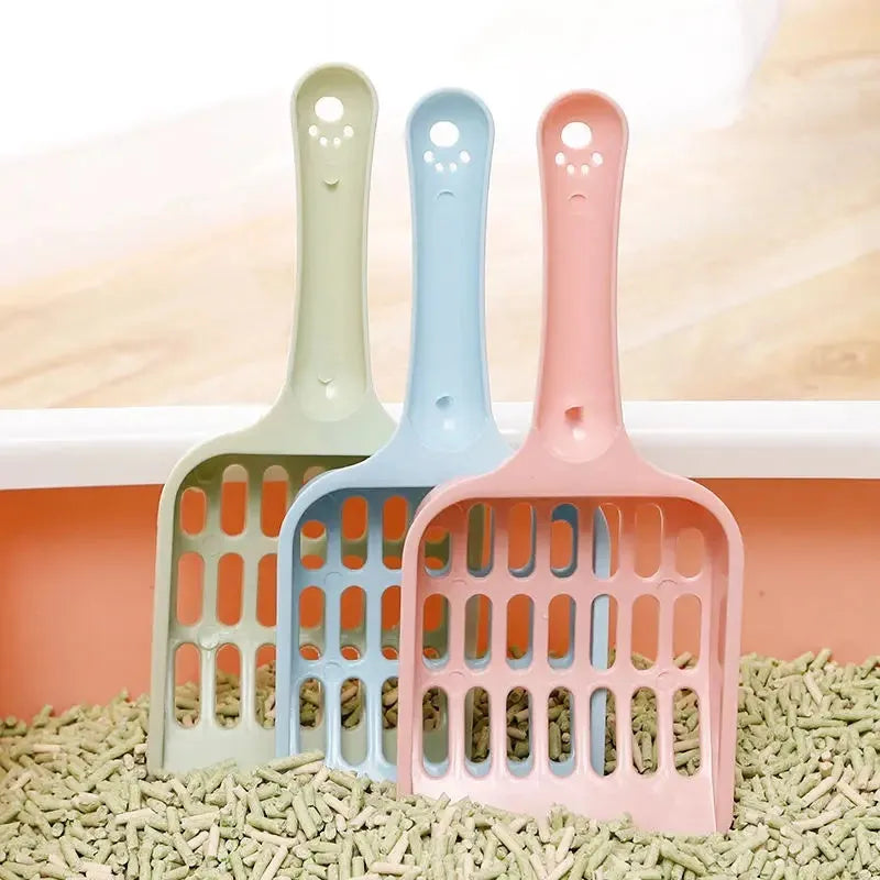 Plastic cat litter scoop in blue, green, or pink colours showing dimensions of 20cm length