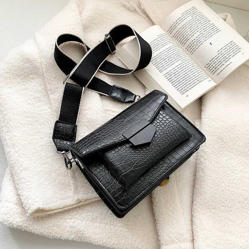 Vintage style crossbody bag in PU leather, shown in black, dimensions 20cm by 14cm.