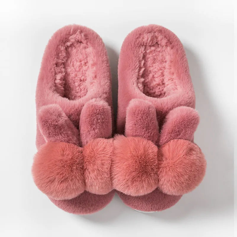 Women's fluffy rabbit fur slippers in pink with a high upper and sewn sole