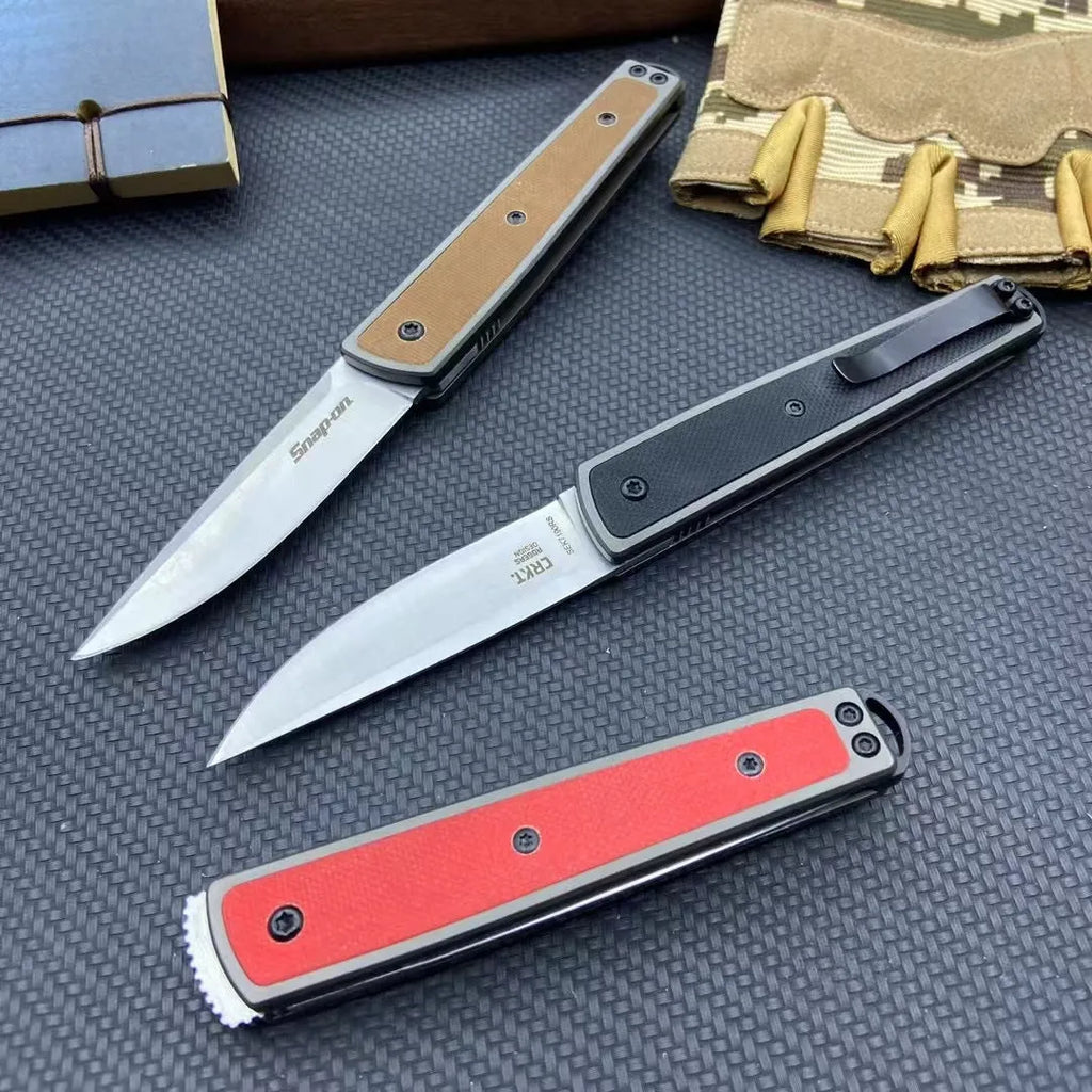 Folding fruit knife with stainless steel blade extended, showing black handle variant with blade measurements