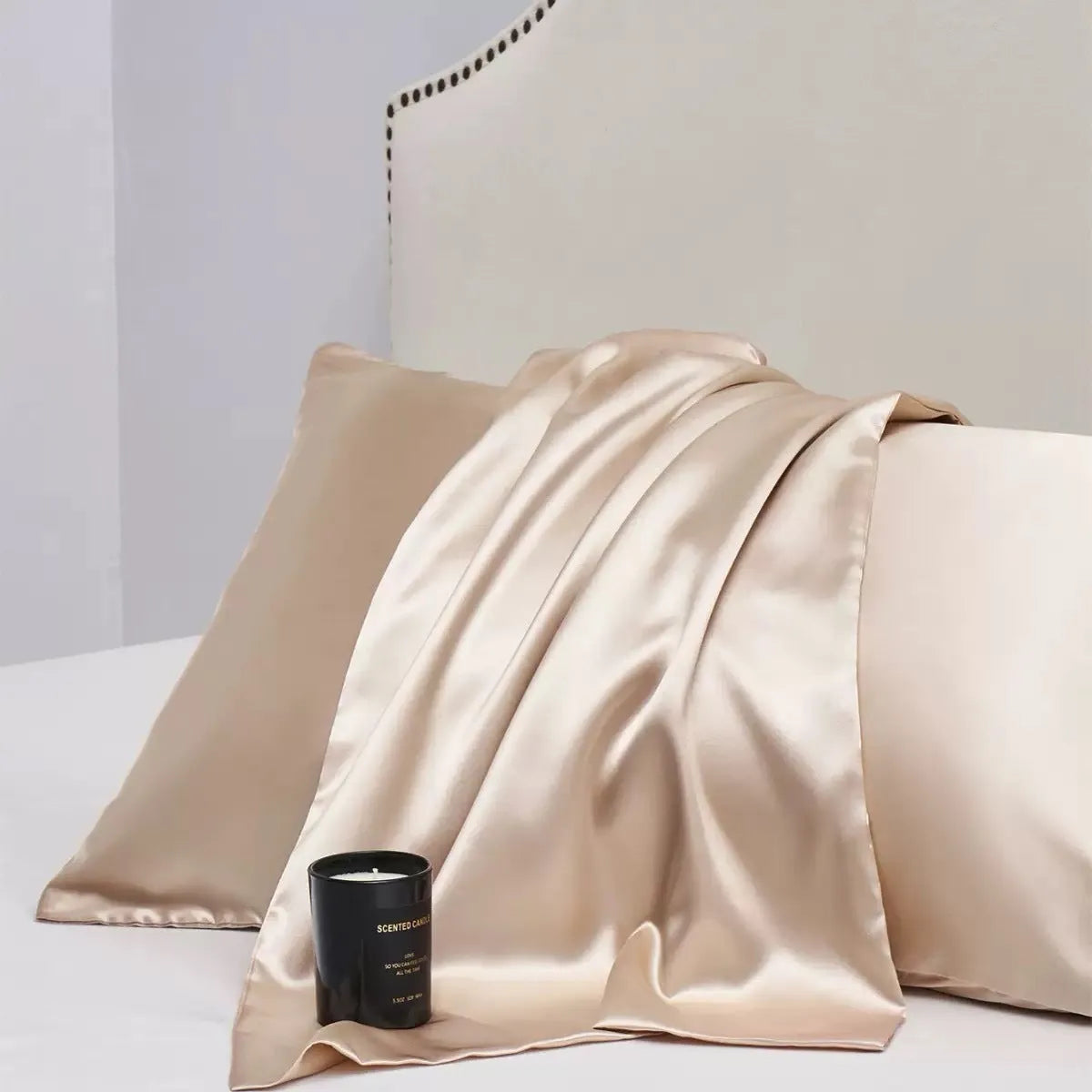 Pair of solid colour satin cloth pillowcases in polyester fibre available in twelve colours and four sizes