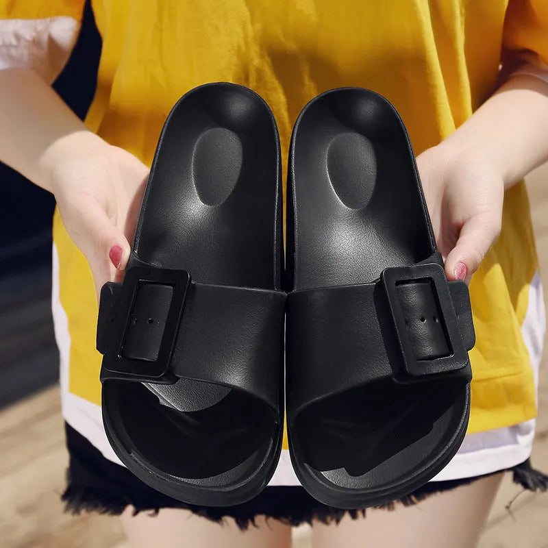 Women's grey blue flip-flop slippers with a single buckle and soft EVA sole.